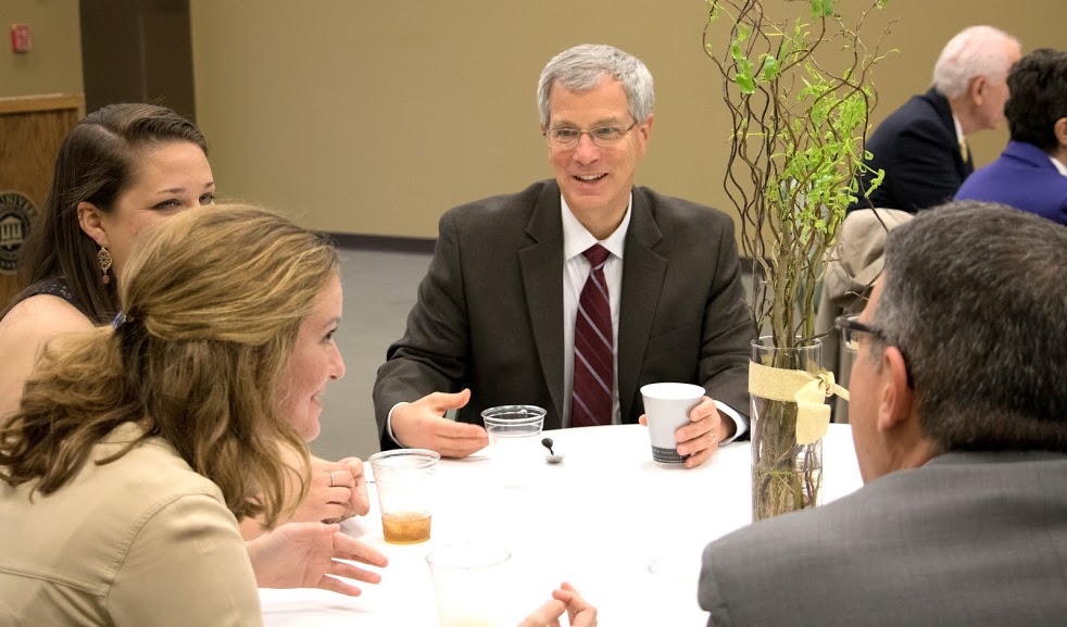 Attendees at the History Department Awards Banquet on May 4, 2017, enjoy a lively table conversation. They are (starting on the front left and going clockwise) Beth Adams, Emily Littleton, Dr. David Thomas, and Dr. Keith Bates (back to camera). Photo by Janelle Vest