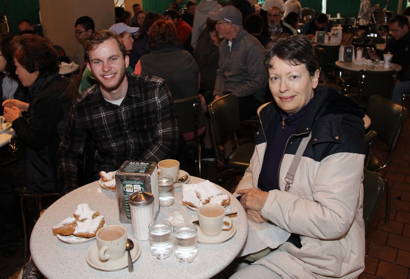 Seth Reid and Dr. Alice-Catherine Carls enjoy coffee, hot chocolate, and beignets at the Café du Monde in New Orleans on the morning of January 7, 2018.