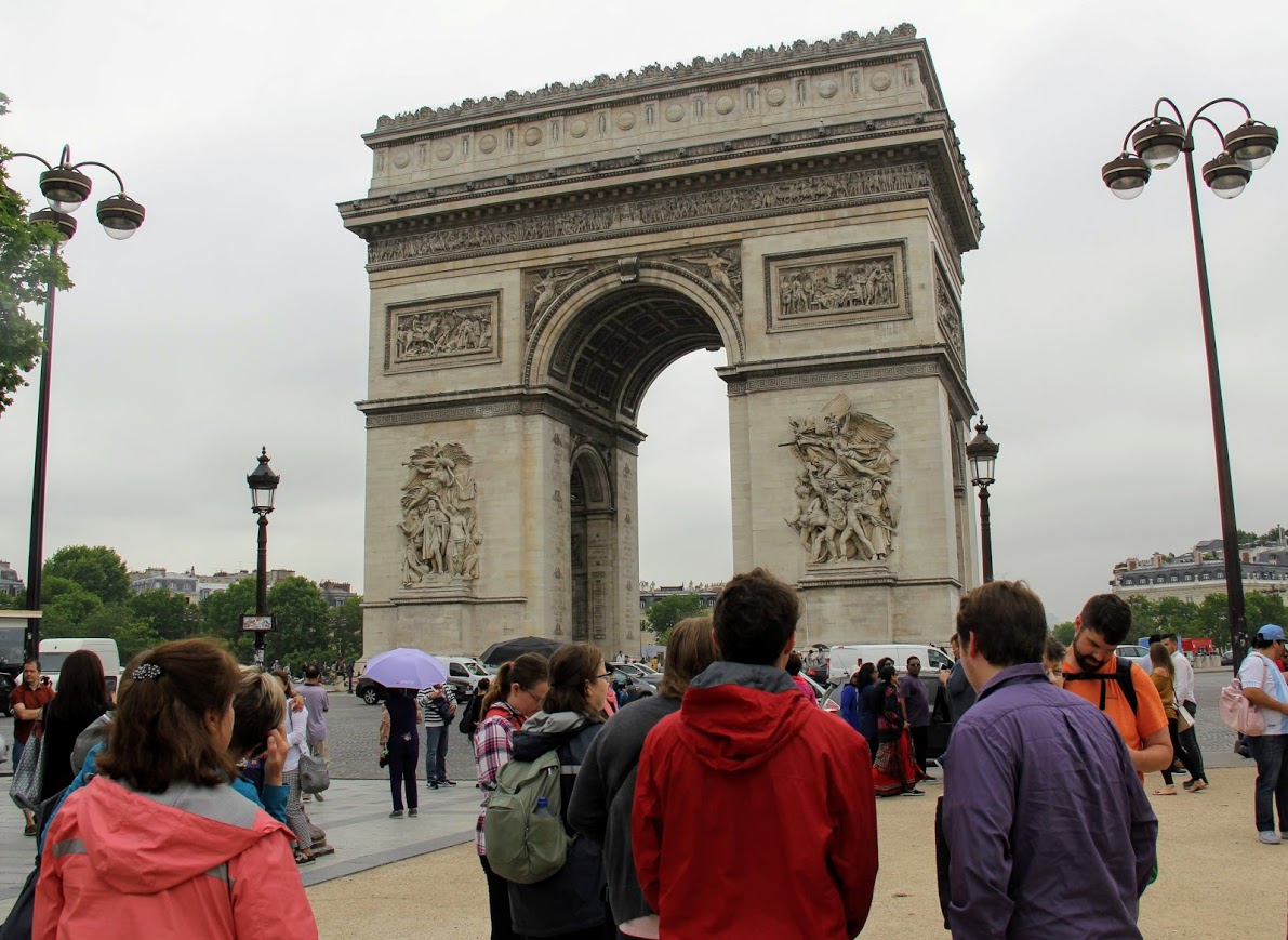 Members of the World War I tour group pause for a few moments to admire the Arc de Triomphe at the Place Charles de Gaulle in Paris on May 29, 2018.