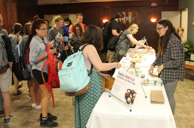Katie Allison (front right) makes a sale to a Union University student at the Delta-Psi chapter's annual bake sale on April 10, 2019.