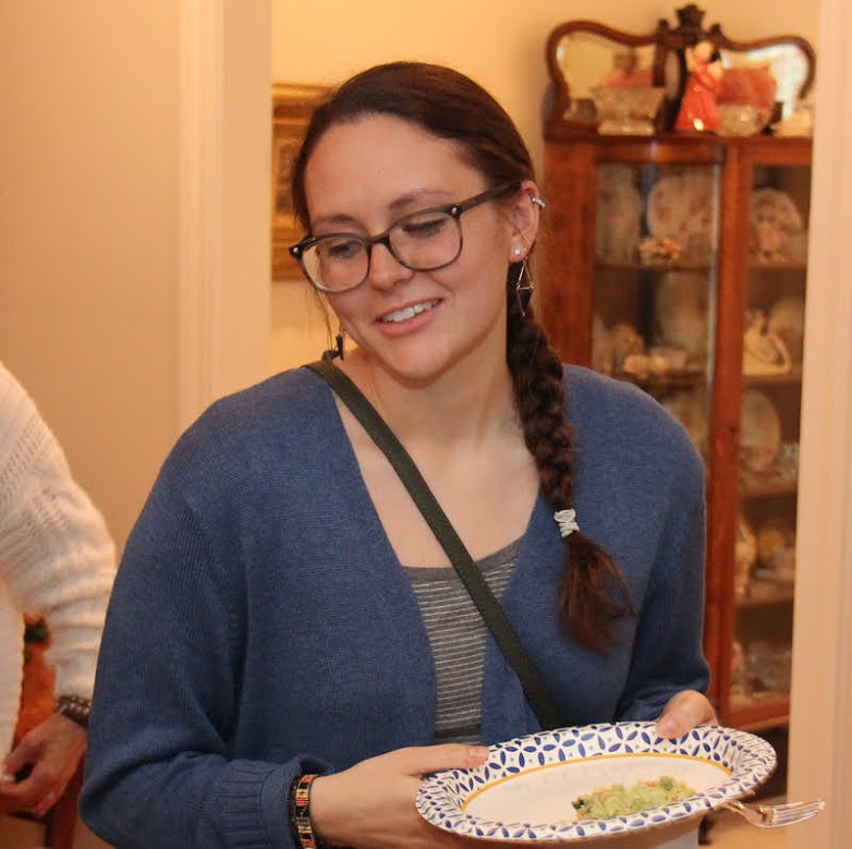 Katie Allison goes through the food line at the Phi Alpha Theta cookout on May 11, 2019.