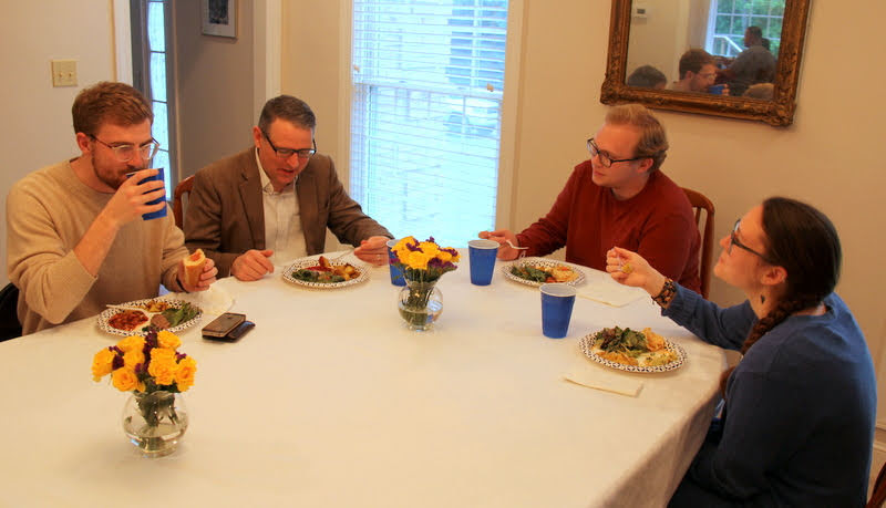 Luke Sower (left to right), Dr. Keith Bates, Nathan Heatherly, and Katie Allison enjoy their meals at the Phi Alpha Theta cookout on May 11, 2019.