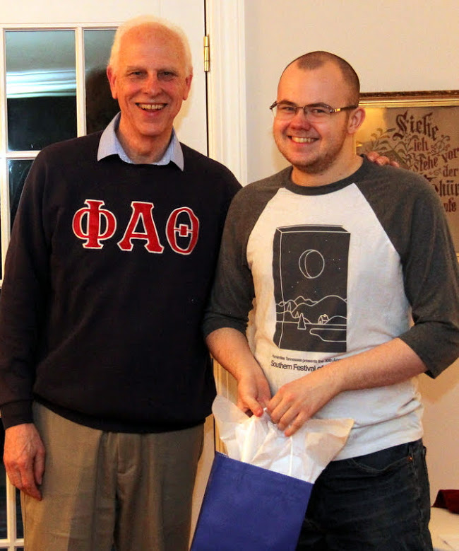 Phi Alpha Theta member Will Choate (right) stands with Dr. Stephen Carls after accepting a graduation award bag at the 27th Annual Phi Alpha Theta/History Department Cookout on May 11, 2019.