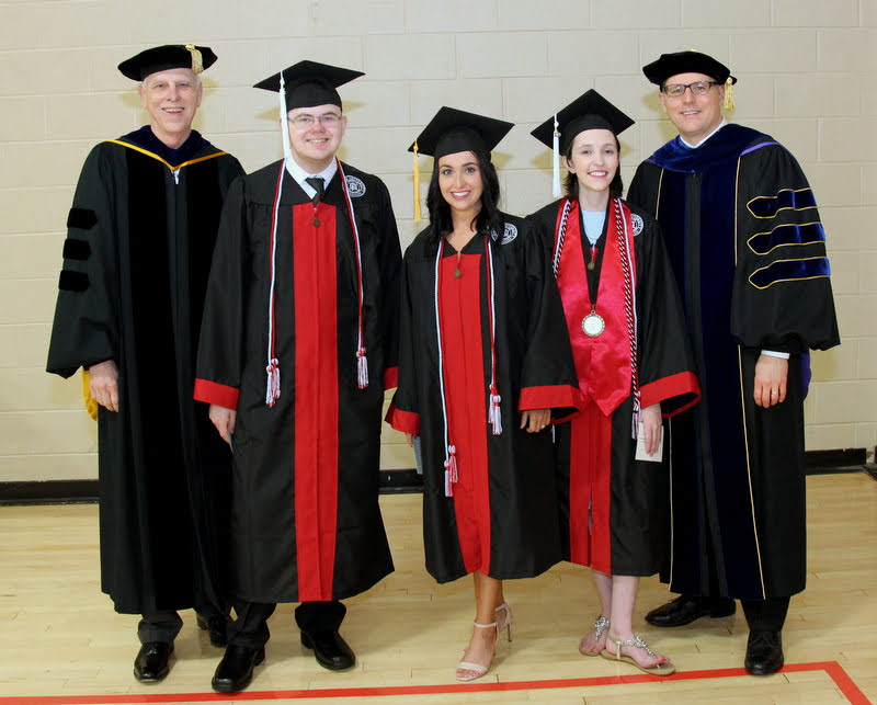 Drs. Stephen Carls (left) and Keith Bates (right) stand with the graduating Phi Alpha Theta student members prior to Union's spring undergraduate commencement on May 18, 2019. The students are (left to right) Will Choate, Marylee Barker, and Lauren Butler.