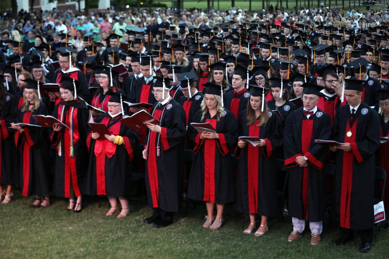 Phi Alpha Theta member Will Choate (front row, fourth from left) joins his classmates and others in singing Union's Alma Mater at the end of the spring graduation on May 18, 2019. Photo by Kristi Woody