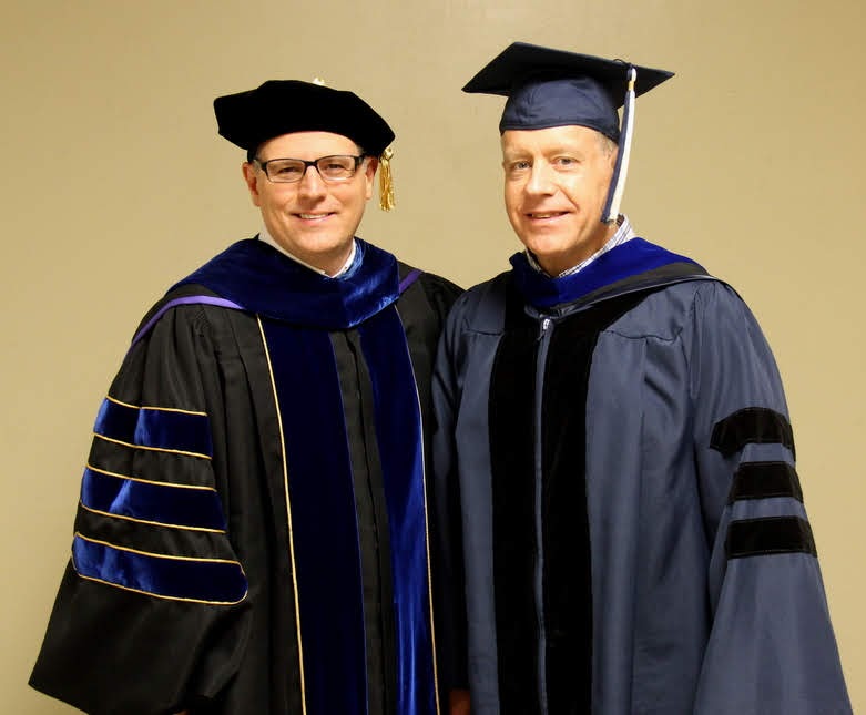 Drs. Keith Bates (left) and Henry Allen of the history department wear their caps and gowns in preparation for Union University's spring undergraduate commencement on May 18, 2019.