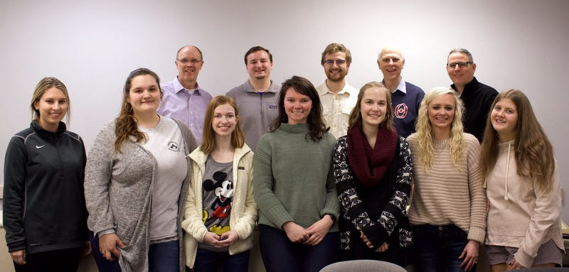 Attendees at the Phi Alpha Theta spring plenary meeting on February 25, 2020, stand together for a photo. They are: (front row, left to right) Addison Osborne, Sandra Allen, Savannah Wright, Audrey Cagle, Megan Ledbetter, Jennifer Briley, and Hannah Ratliff; (back row, left to right) Robert Briley, Macon Bullock, Luke Sower, Dr. Stephen Carls, and Dr. Keith Bates. Photo by Naomi Mengel