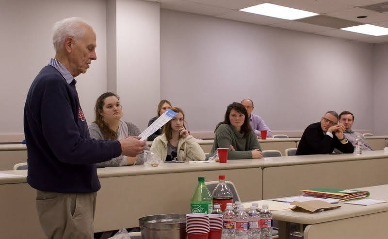 Dr. Stephen Carls reads a letter of congratulations from the Phi Alpha Theta national office to the new Delta-Psi chapter members on February 25, 2020. Photo by Naomi Mengel