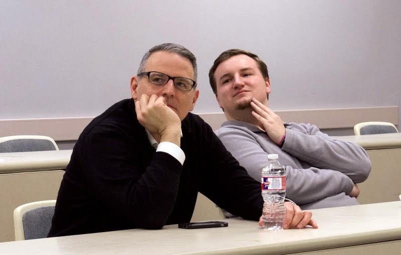 Dr. Keith Bates (left) and Macon Bullock listen as Dr. Stephen Carls reads a letter of congratulations from the Phi Alpha Theta national office to the newly inducted PAT members during the Delta-Psi chapter's spring plenary meeting on February 25, 2020. Photo by Naomi Mengel