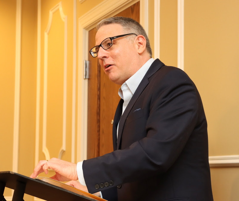 Dr. Keith Bates pays tribute to retiring colleague Dr. Stephen Carls at the History Department Awards Banquet on April 27, 2023.