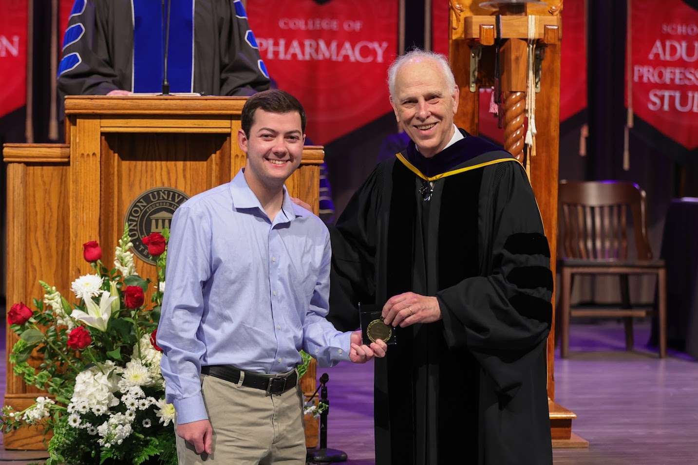 Jack Jenkins (left) receives the Academic Excellence Medal in History from Dr. Stephen Carls at Union's Awards Day Convocation on April 21, 2023.