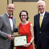 Lauren Butler, president of the Delta-Psi chapter of Phi Alpha Theta, accepts the Phi Alpha Theta Scholarship Pin and Academic Excellence Certificate at the history awards banquet on May 2, 2019. Standing with her are Robert Briley (left) and Dr. Stephen Carls. Photo by Nicole Grim