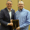 Phi Alpha Theta member Will Choate accepts the History Minor Award from Dr. Keith Bates at the history awards banquet on May 2, 2019. Photo by Nicole Grim