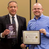 Will Choate (right) accepts a book and certificate of recognition from Dr. Henry Allen at the history awards banquet on May 2, 2019, for his paper presentation at the Tennessee Phi Alpha Theta Regional Conference at Belmont University on March 30, 2019. Photo by Nicole Grim