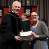 Phi Alpha Theta member Katie Allison accepts the first-place prize in the 2019 Dr. James Alex Baggett History Research Paper Competition from Dr. Stephen Carls at Union University's Awards Convocation on May 3, 2019. Photo by Kristi Woody