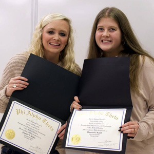 Newly inducted Phi Alpha Theta members Jennifer Briley (left) and Hannah Ratliff display their certificates of membership at the Delta-Psi chapter plenary meeting on February 25, 2025. Photo by Naomi Mengel