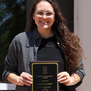 Graduating Phi Alpha Theta member and history major Katie Allison holds her History Major Award for outstanding work in the major on April 30, 2020.
