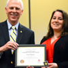 Faith Bagley accepts the 2015 Phi Alpha Theta Scholarship Pin and Academic Excellence Certificate