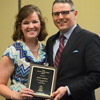 Dr. Keith Bates presents the History Major Award to Phi Alpha Theta member Sarah Carroll