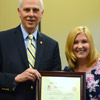 Dr. Stephen Carls presents a certificate of appreciation to Hannah Jones