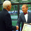 Stephen Carls congratulates Union University President Samuel W. 'Dub' Oliver