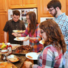 Guests go through the food  line at the Phi Alpha Theta cookout on May 8, 2015.