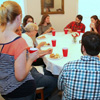 Guests at the 23rd Phi Alpha Theta/History Department Cookout on May 8, 2015, enjoy food and conversation together.