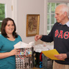 Phi Alpha Theta member Faith Bagley accepts a graduation award bag from Dr. Stephen Carls at the 23rd Annual Phi Alpha Theta/History Department Cookout on May 8, 2015.