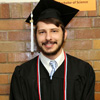 Phi Alpha Theta member Hunter Hawes stands in the lineup area assigned to BA students in theology prior to Union's spring graduation on May 16, 2015.