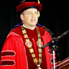 Union University President Dr. Samuel W. Oliver watches from the graduation stage while students take their places at the start of the school's spring commencement services on May 16, 2015.