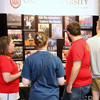 History student representatives talk to classmates at the history display table during the Student Organizations Fair on August 17, 2015. They are: Rutledge Honorary History Club President Kathryn Mitchell (left); Phi Alpha Theta President Nicholas Hancock (third from left); and Phi Alpha Theta Vice President Allen Bradley (second from right).