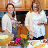 History students Jordan Sellers and Laura Beth Russell make their way through the serving line at the History Welcome Reception on August 31, 2015.