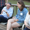Phi Alpha Theta member Emily Littleton (center) talks to Dr. Keith Bates at the History Welcome Reception on August 31, 2015, while history major Laura Beth Russell (right) checks out information on her i-phone.