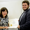 Priscilla Porter accepts her Phi Alpha Theta membership certificate from Delta-Psi President Nicholas Hancock at the society's fall initiation/plenary meeting on September 14, 2015. Photo by Elizabeth Wilson