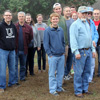 Participants in the history department's community service project at Britton Lane Battlefield join together with their hosts for a photo after being divided into four groups for hands-on cannon firings. Pictured in the photo are: (left to right) Logan Smith, Allen Bradley, Emily Littleton, Priscilla Porter, Dr. Keith Bates, Dr. David Thomas, Jessica Barton, Beth Adams, Gideon Ragland (front, dressed in blue), Stephen Lewoczko, Dr. Henry Allen, Ali Renckens, Nicholas Hancock (behind Renckens), host Jim Weaver, Dr. Terry Lindley, Devin Dean, Katherine Cheshire, Jordan Sellers, Hannah Conway, and host James Price.