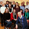 Attendees at the Franco-American Christmas dinner on December 5, 2015, join together for a group photo at the beginning of the evening. They are: (front, kneeling) Dr. Stephen Carls; (seated, left to right) Beth Adams, Kathryn Mitchell, Priscella Porter, and Karis Lancaster; (standing, third row) Allen Bradley, Nancy Thomas, Jordan Sellers, Emily Littleton, Gideon Ragland, Dr. Terry Lindley, and Becky Lindley; (back row, left to right) Ashton Hostetler, Dr. David Thomas, Nicholas Hancock, Dr. Keith Bates, Dr. Henry Allen, and Haelim Allen. Hostess Dr. Alice-Catherine Carls took the photo.