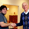 Dr. Stephen Carls (right) congratulates Ashton Hostetler at the Franco-American Christmas dinner on December 5, 2015, for Ashton's successful completion of a bachelor's degree in history at Union University.