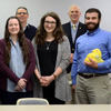 Phi Alpha Theta members in attendance at the Delta-Psi chapter's spring plenary meeting on February 22, 2016, pause for a photo. They are: (front row, left to right) Nicholas Hancock, Seth Reid, Alexandra Martin, Kelsea DuVall, Kathryn Mitchell, Lauren Geary, Livvy Winters, and Allen Bradley; (back row, left to right) Stephen Lewoczko, Jeremy Ebert, Emily Littleton, Jordan Sellers, Dr. Henry Allen, Robert Briley, Dr. Keith Bates, and Dr. Stephen Carls. Photo by Elizabeth Wilson
