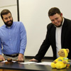 Phi Alpha Theta Vice President Allen Bradley (left) and President Nicholas Hancock smile while conducting the Delta-Psi chapter's business meeting on February 22, 2016.