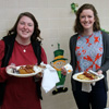 Delta-Psi chapter members Kathryn Mitchell (left) and Beth Adams smile after going through the breakfast line at the Jackson Old Hickory Rotary Club Pancake Breakfast on March 14, 2016.