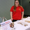 Hannah Conway works as a salesperson at the Franco-American bake sale on April 20, 2016