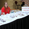 Hannah Conway serves as a salesperson at the Phi Alpha Theta bake sale on April 20, 2016.