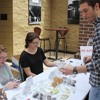 Luke Adkins (standing) prepares to make a purchase at the Phi Alpha Theta Franco-American bake sale on April 20. Kathryn Mitchell (left, sitting) and Olivia Winters work as salespersons.