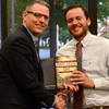 Dr. Keith Bates (left) presents a certificate of commendation and a book to Jeremy Ebert at the history awards banquet on May 5, 2016, for Jeremy's outstanding paper presentation at the Tennessee Phi Alpha Theta Regional Conference on April 2. Photo by MiKalla Cotton