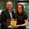 Dr. Keith Bates presents a certificate of commendation and a book to Olivia Winters at the history awards banquet on May 5, 2016, for the excellent paper that she presented at the Tennessee Phi Alpha Theta Regional Conference on April 2. Photo by MiKalla Cotton