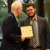 Dr. Stephen Carls (left) presents a certificate of appreciation to Nicholas Hancock at the history awards banquet on May 5, 2016, for his work as president of Phi Alpha Theta in 2015-2016. Photo by MiKalla Cotton