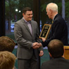J. Jason Williams receives congratulations from Dr. Stephen Carls at the history awards banquet on May 5, 2016, as the recipient of the 2016 History Alumni Distinguished Achievement Award. Photo by MiKalla Cotton
