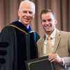 Dr. Stephen Carls (left) presents the first place award in the Dr. James Alex Baggett History Research Paper Competition to Seth Reid at Union University's Annual Awards Convocation on May 6, 2016. Photo by Kristi Woody