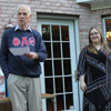 Graduating senior Lauren Geary receives a gift bag from Dr. Stephen Carls at the Annual Phi Alpha Theta/History Department Cookout on May 13, 2016.