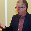 Dr. Robert Citino answers a history question at a dinner in his honor at Union University on October 29, 2015.